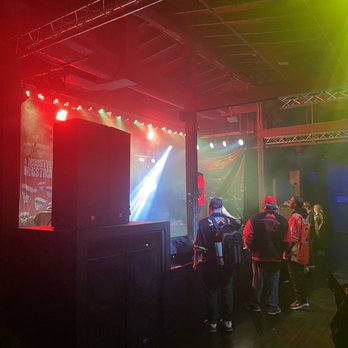 Mobstyle Christmas - a group of people standing in front of a stage - Music Venues Near Me - Louisville, Kentucky Mobstyle Christmas - a group of people standing in front of a stage - Music Venues Near Me - Louisville, Kentucky