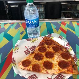 a slice of pepperoni pizza on a paper plate a slice of pepperoni pizza on a paper plate