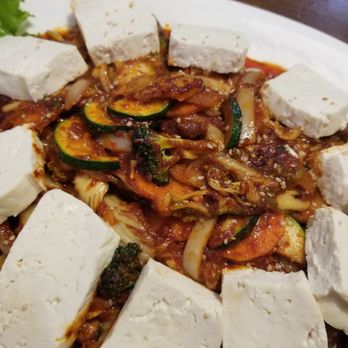 Seoul Garden - Tofu kimchi- fresh thick cut slices of tofu, spicy pork belly, onions, peppers, broccoli, carrots and cucumbers.  *My favorite dish* $27 - Korean Near Me - Greensboro, North Carolina