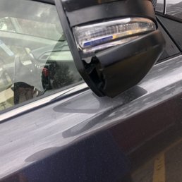 Cracked plastic around mirror.
