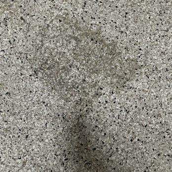 Peacher’s Concrete Creations - Garage floor with large ruts after a week and the first rain. - Masonry/Concrete Near Me