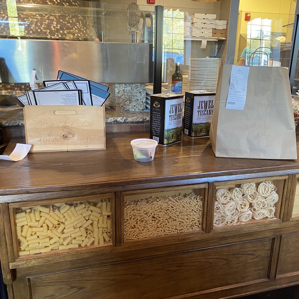 Crostatas Rustic Pizza - a wooden counter with a paper bag on top of it - Pizza Near Me - Highland Heights, Ohio Crostatas Rustic Pizza - a wooden counter with a paper bag on top of it - Pizza Near Me - Highland Heights, Ohio