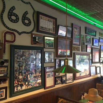Kumback Lunch - Pictures of Kumbach and Perry history cover the walls. - New American Near Me - Perry, Oklahoma