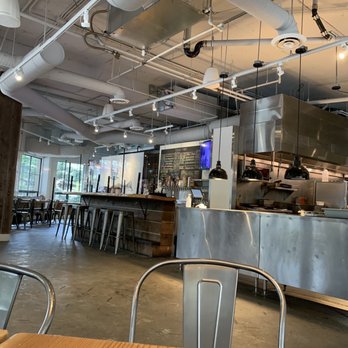 Hunter Gather - a view of a kitchen and dining area - Barbeque Near Me - Whistler, British Columbia Hunter Gather - a view of a kitchen and dining area - Barbeque Near Me - Whistler, British Columbia
