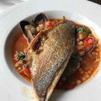 Sam's Chowder House - Branzino Bass with fresh baby clams in a cioppino type broth - Seafood Near Me - Half Moon Bay, California Sam's Chowder House - Branzino Bass with fresh baby clams in a cioppino type broth - Seafood Near Me - Half Moon Bay, California