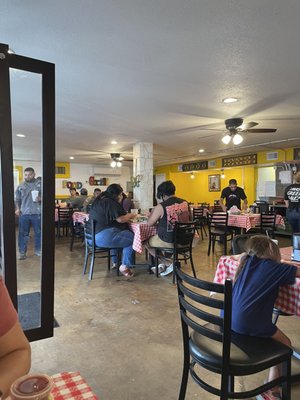 Photo of Pollos Asados Los Norteños - San Antonio, TX, US. people sitting at tables in a restaurant