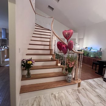 Strahle Tile & Granite - a staircase leading to a living room - Flooring Near Me - Albuquerque, New Mexico