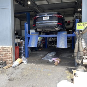 Extreme Performance Mufflers - Old exhaust being taken off. - Auto Repair Near Me - Norcross, Georgia Extreme Performance Mufflers - Old exhaust being taken off. - Auto Repair Near Me - Norcross, Georgia