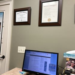 Professional Eyecare of Statesboro - Dr Piette diplomas and patient area