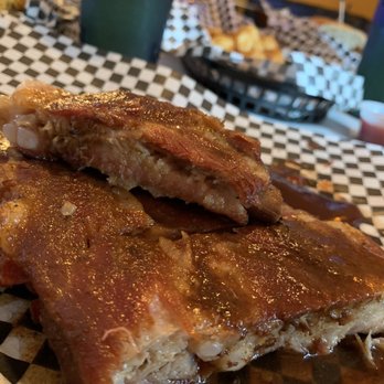 Satchmo's - 1/2 rack of pork ribs--look at those juices! - Cajun/Creole Near Me - Flagstaff, Arizona Satchmo's - 1/2 rack of pork ribs--look at those juices! - Cajun/Creole Near Me - Flagstaff, Arizona