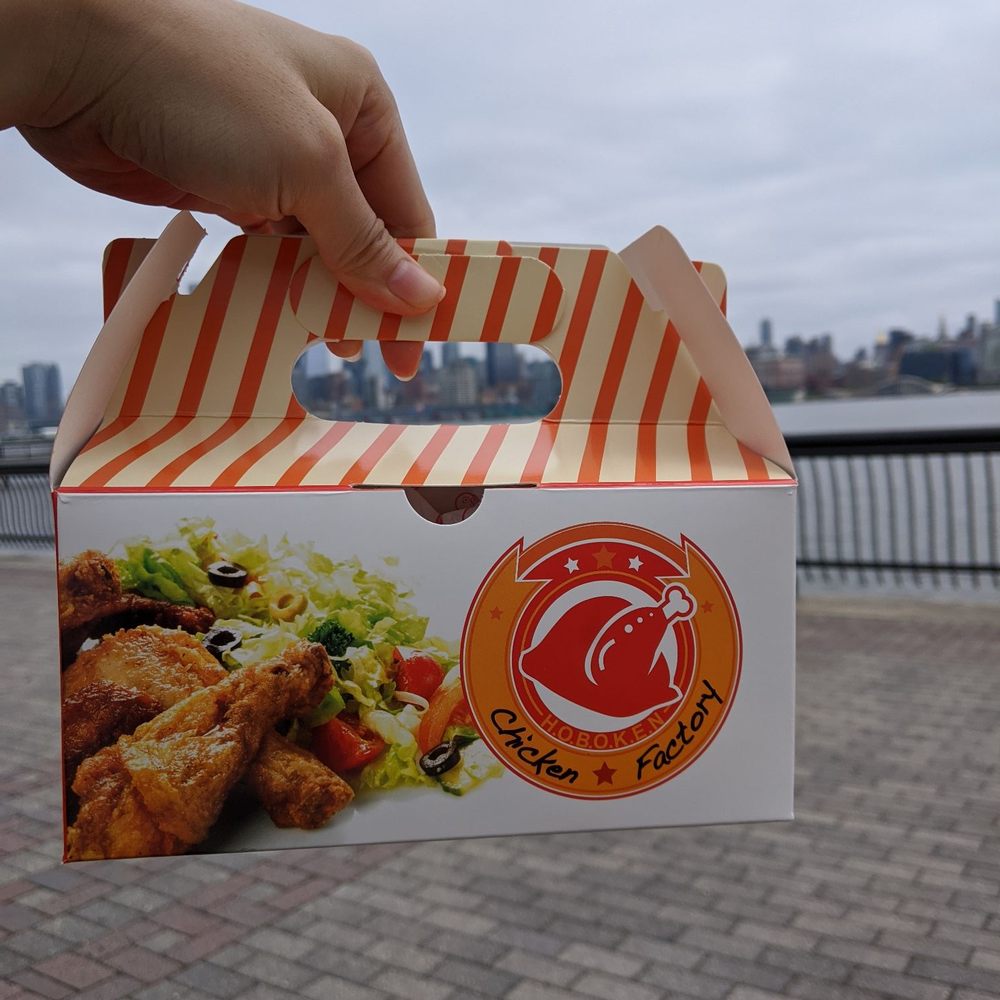 Chicken Factory - a hand holding a box of chicken - Chicken Wings Near Me - Hoboken, New Jersey Chicken Factory - a hand holding a box of chicken - Chicken Wings Near Me - Hoboken, New Jersey