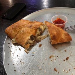 a half eaten pizza on a plate