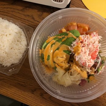 AhiPoki - Mixed in spicy creamy poke bowl with white rice. Fish and toppings are in a container over ice - Poke Near Me - West Covina, California