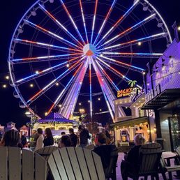 Ferris Wheel and chairs in front of Ole Smoky Distillery.