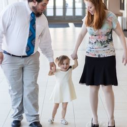 Chari Laree Photography - Family walking down a hall
