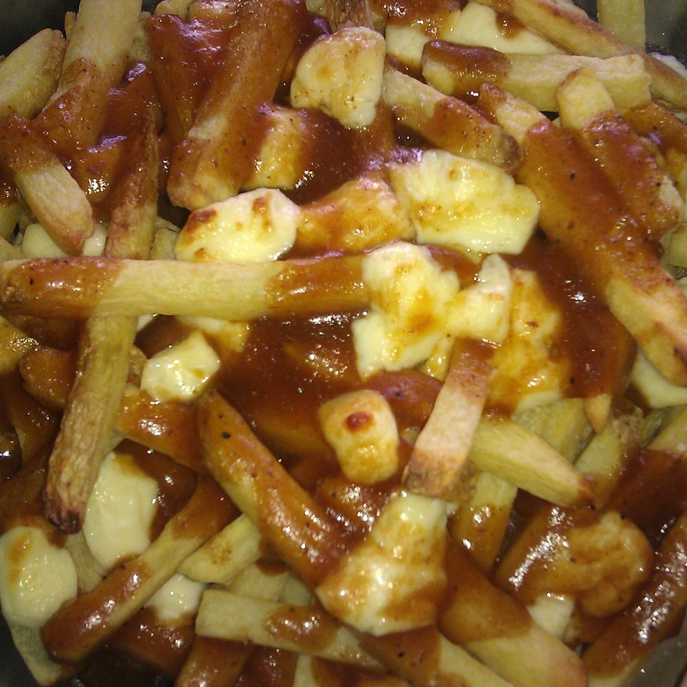 Trader Joe's - Poutine fries from trader joes....imo they are a 6/10 the fries themselves are very plain tasting.. - Grocery Near Me - Boulder, Colorado