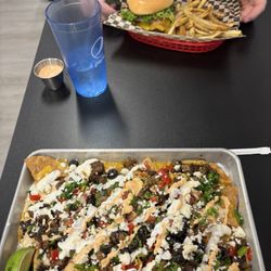 Special ribeye nachos and elk burger with fries
