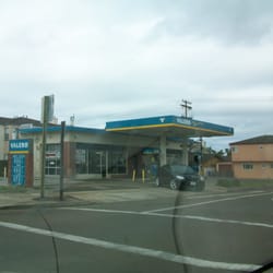 Valero Gas Station - Valero gas station through a windshield on a rainy day.