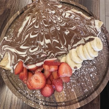 Cairo Cafe - Crepe- it's good but there is a wood taste that comes from serving it directly on the wood - Desserts Near Me - Blaine, Minnesota