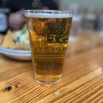 The Trailhead - a glass of beer on a table - Burgers Near Me - Black Mountain, North Carolina