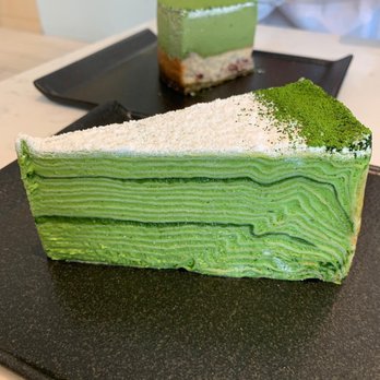 L'otus Cake Boutique - Matcha crepe cake and in the background is the matcha cheese cake - Patisserie/Cake Shop Near Me - Richmond, British Columbia L'otus Cake Boutique - Matcha crepe cake and in the background is the matcha cheese cake - Patisserie/Cake Shop Near Me - Richmond, British Columbia