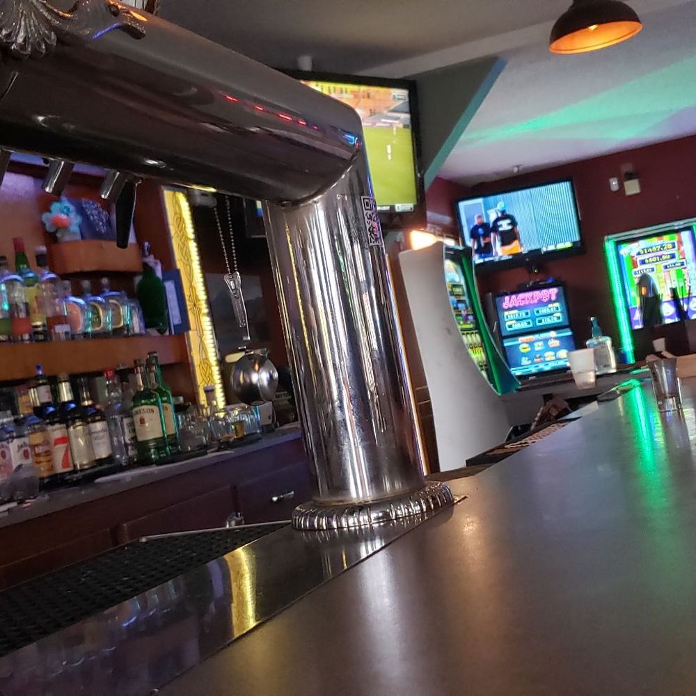Gingerz Sportz Pub And Grill - a man sitting at the bar - American Near Me - Milwaukee, Wisconsin Gingerz Sportz Pub And Grill - a man sitting at the bar - American Near Me - Milwaukee, Wisconsin