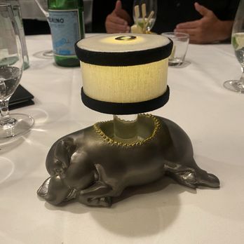 Morton's The Steakhouse - The "sleeping pig" is a symbol of Morton's The Steakhouse, originally a pewter oil lamp that graced their tables since the first restaurant - Steakhouses Near Me - Cleveland, Ohio