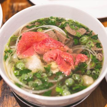 Saigon Rolls - The soul of Phở Bò lies in its broth, which is simmered for hours using beef bones, oxtail, and a blend of aromatic spices. - Vietnamese Near Me - Alexandria, Virginia