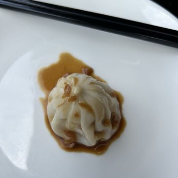 Northern Cafe - One soup dumpling with their signature sauce. - Chinese Near Me - Long Beach, California