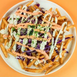 Santorini's - Loaded Feta Fries at Santorini's West Bountiful: Generous feta and crunchy fresh cabbage. A spicy local favorite at The Commons!