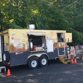 Ted's Restaurant - a man walking past a food truck - Food Trucks Near Me - Hartford, Connecticut Ted's Restaurant - a man walking past a food truck - Food Trucks Near Me - Hartford, Connecticut