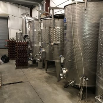 Milagro Farm Winery - Stainless steel fermenting tanks in the barrel room. - Wineries Near Me - Ramona, California