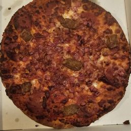a pizza in a box on a table a pizza in a box on a table