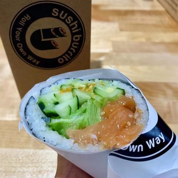 IJ Sushi Burrito - a hand holding a burrito - Sushi Bars Near Me - Seattle, Washington IJ Sushi Burrito - a hand holding a burrito - Sushi Bars Near Me - Seattle, Washington