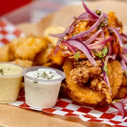 El Huarique - Fried shrimp, calamari,white bass fish, served with tartar, sarza criolla and yucca fries