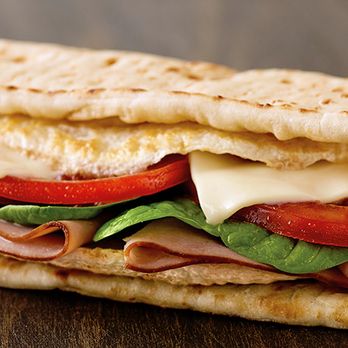 Subway - a close up of a sandwich on a wooden table - Sandwiches Near Me - Brooklyn, New York Subway - a close up of a sandwich on a wooden table - Sandwiches Near Me - Brooklyn, New York