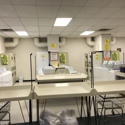 Cajun Laundry & Dry Cleaners - Plenty of folding tables and carts always available.