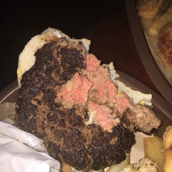 Laugh Factory - Hamburger looks done on the outside, but take a look on at this! I had already taken 2 bites! - Comedy Clubs Near Me - Long Beach, California