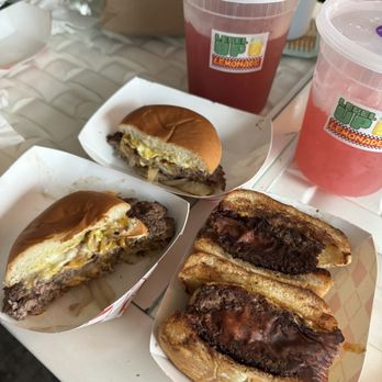 Nimbuya - a variety of food items on a table - Burgers Near Me Nimbuya - a variety of food items on a table - Burgers Near Me