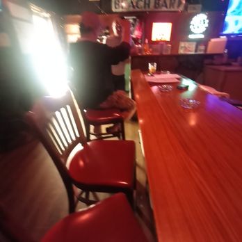 Memories Lounge - a bar with red chairs and neon signs - Lounges Near Me - Sarasota, Florida Memories Lounge - a bar with red chairs and neon signs - Lounges Near Me - Sarasota, Florida