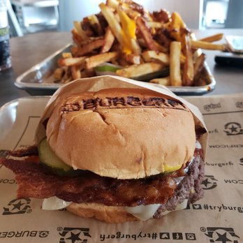 BurgerFi - Bacon cheeseburger with Swiss cheese and large chili cheese fries. The pickles and mustard were add-on's. - Burgers Near Me - Peachtree Corners, Georgia BurgerFi - Bacon cheeseburger with Swiss cheese and large chili cheese fries. The pickles and mustard were add-on's. - Burgers Near Me - Peachtree Corners, Georgia