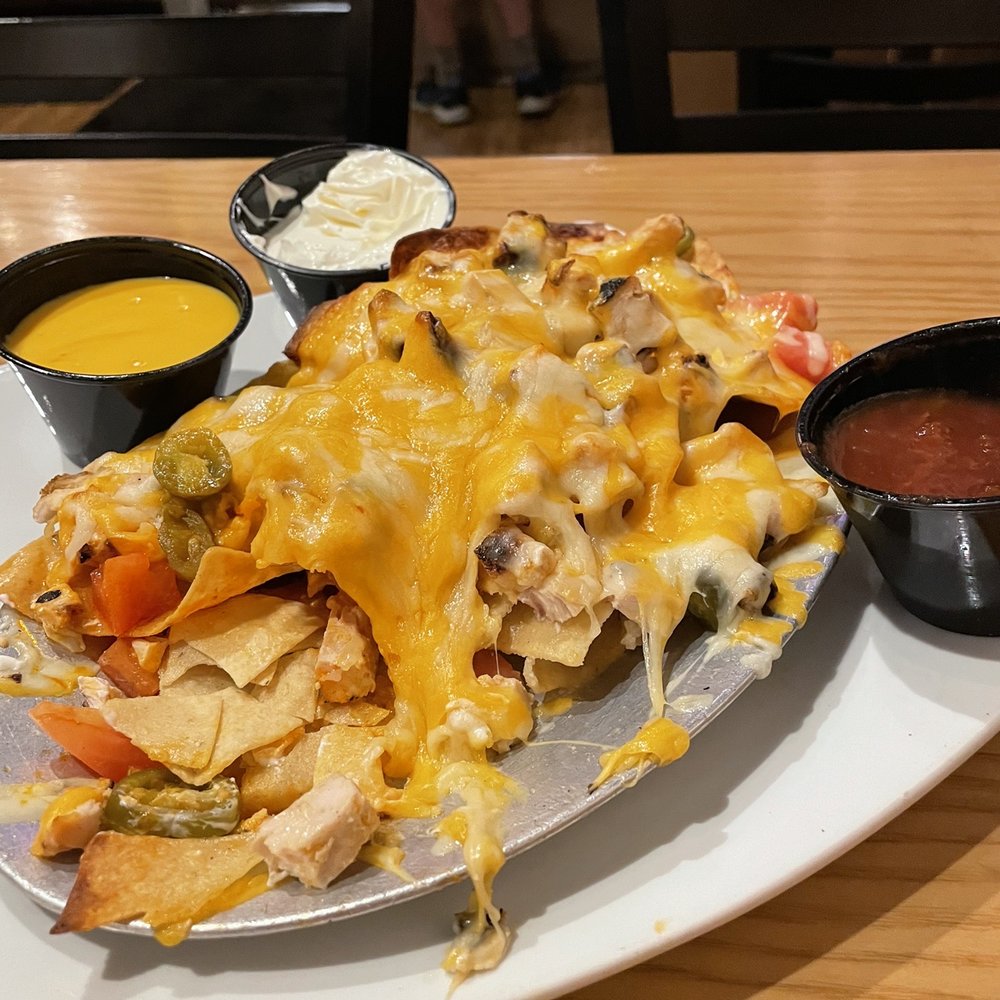 Archie Moores NH - Buffalo Nachos 1/2 portion. Great chunky Blue Cheese dressing. Side of beer cheese dip,salsa and sour cream. - Dive Bars Near Me - New Haven, Connecticut Archie Moores NH - Buffalo Nachos 1/2 portion. Great chunky Blue Cheese dressing. Side of beer cheese dip,salsa and sour cream. - Dive Bars Near Me - New Haven, Connecticut