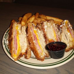 Bennigan's - World Famous Monte Cristo with golden thick cut fries.