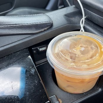 Dunkin' - a cup of iced coffee in a cup holder - Donuts Near Me - Owings Mills, Maryland Dunkin' - a cup of iced coffee in a cup holder - Donuts Near Me - Owings Mills, Maryland