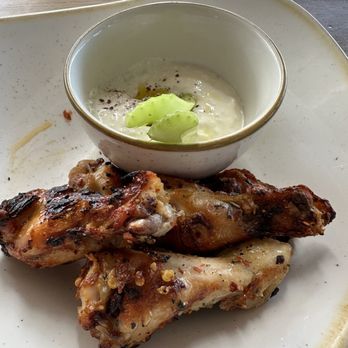 Monkeypod Kitchen - Rosemary Roasted Chicken Wings with goat yogurt dip... forgot to take a pic, so 1 celery stick and 2 wings were eaten. - New American Near Me - Lahaina, Hawaii