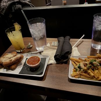 Star Cinema Grill - Some mozzarella sticks and loaded fries. The pineapple drink is for adults only - Cinema Near Me - South Barrington, Illinois Star Cinema Grill - Some mozzarella sticks and loaded fries. The pineapple drink is for adults only - Cinema Near Me - South Barrington, Illinois