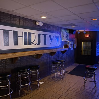 Thirsty's - a bar with stools and neon signs - Dive Bars Near Me - Pittsford, New York