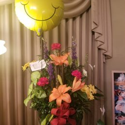 Flowers for t funeral of a 16 year old boy with special needs with a contagious smile. Smiley balloon was asked for by the customer. Flowers for t funeral of a 16 year old boy with special needs with a contagious smile. Smiley balloon was asked for by the customer.