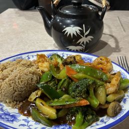 a plate of stir fried vegetables and rice a plate of stir fried vegetables and rice