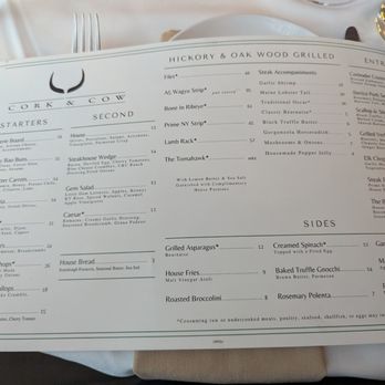 Cork & Cow - Looking at the menu. - Steakhouses Near Me - Franklin, Tennessee Cork & Cow - Looking at the menu. - Steakhouses Near Me - Franklin, Tennessee